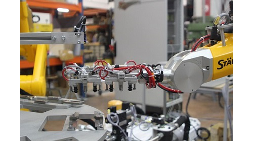 poste robotisé, préhenseur spécifique